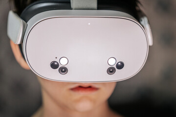Individual wearing a virtual reality headset, immersed in an interactive experience, showcasing...