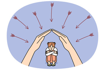 Mother hands protect little daughter from dangers and arrows, for concept of maternal philanthropy. Maternal care for children and readiness for self-sacrifice in process of education