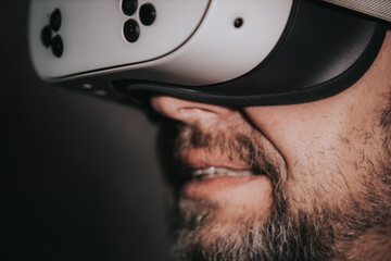 Man wearing virtual reality headset, immersed in digital experience, showcasing advanced technology and innovation in modern entertainment and gaming environments