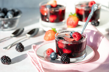 Fresh and delicious homemade mixed berry jelly cups, ready for eating.