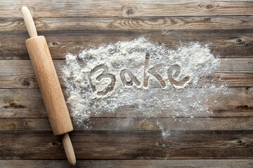 A baking concept background image with flour and a rolling pin.