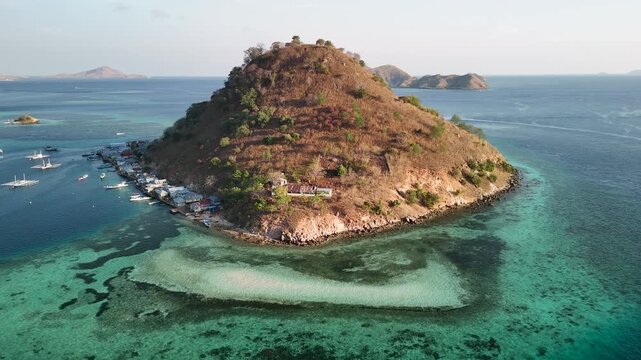 Scenic aerial landscape of Pulau Kukusan Indonesia with clear blue sea and coastal vegetation