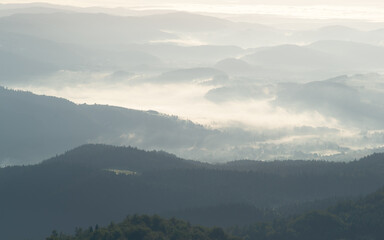 Abstract mountain fog background with soft layered silhouettes. Minimalist composition with gentle tones and atmospheric depth.