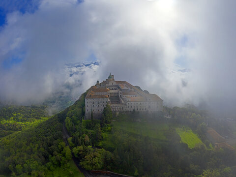 Monte Cassino monastery in the morning mist. Monte Cassino Abbey, the first monastery of the Benedictine order, located to the south of Rome, at the top of Mount Cassino