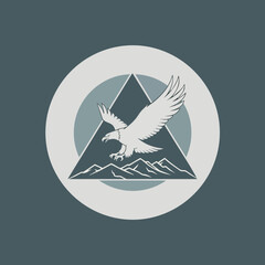 Majestic Eagle Soaring Over Mountain Peaks in a Circular Emblem Design.