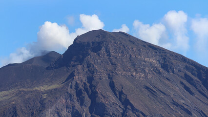 Stromboli volcano hissing steam into blue sky