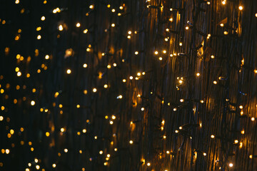 Naklejka premium Golden stars backgrounddecorative lighting in soft focus as a background motif