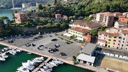 Drone shot of Fezzano, a small seaside town in Liguria surrounded by green hills