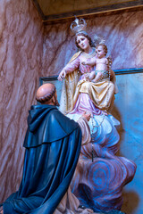 Our Lady of Fatima with the baby Jesus in her lap being blessed inside the Church of Bom Jesus.