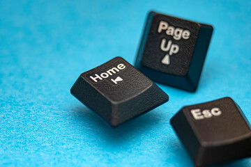 Macrophotography with captures the essential Home and navigation keyboard keys isolated against blue background. Highlighting the hi-tech abstract concept. Ideal for IT design. Selective focus.