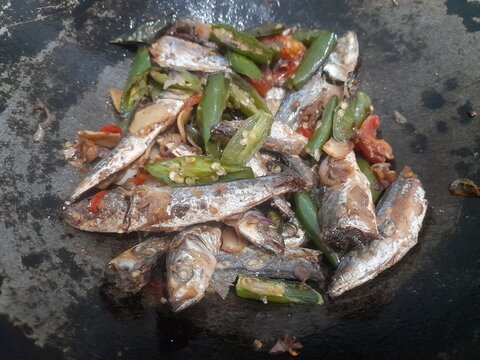 Stir fried salted fish (ikan asin pindang cue)&nbsp; in a frying pan. Healthy food background concept, food recipes, breakfast, lunch, dinner, culinary, restaurant, gourmet, meal, cuisine
