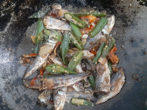 Stir fried salted fish (ikan asin pindang cue)&nbsp; in a frying pan. Healthy food background concept, food recipes, breakfast, lunch, dinner, culinary, restaurant, gourmet, meal, cuisine