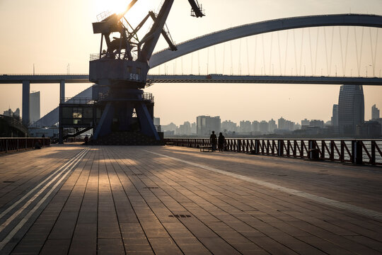 shanghai sunset lupu bridge and crane