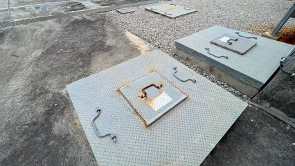 Underground water storage tank with a strong metal cover, designed for durability and safety,