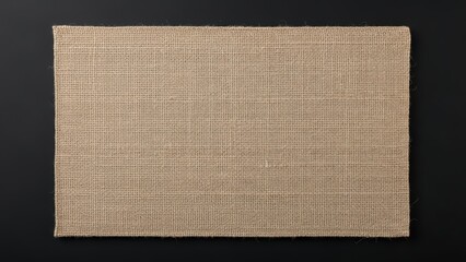 Rectangular burlap fabric on a dark black background