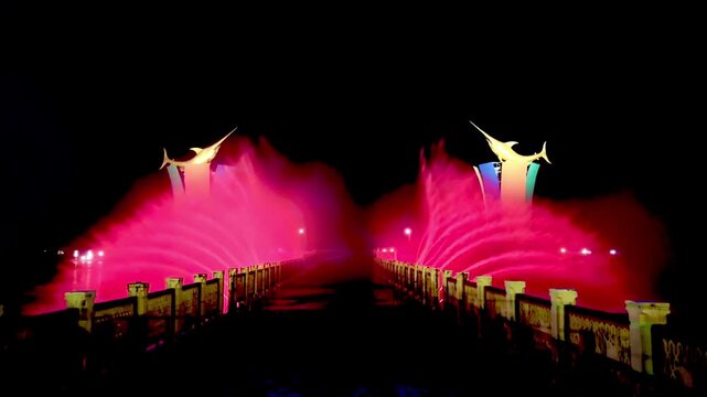 A dancing water show with sophisticated technology and a beautiful combination of colorful lights at the Siring Laut location in Kotabaru Regency, Indonesia.