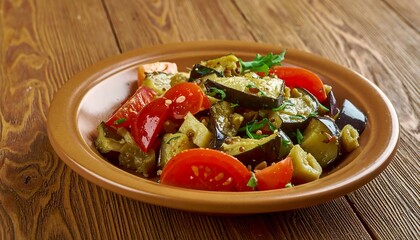 Delicious Eggplant Salad with Tomatoes and Herbs on Rustic Plate.