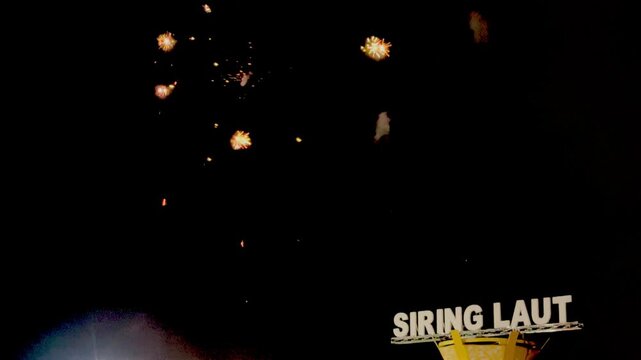 Night fireworks lit up the dark sky above an iconic building on the "Siring Laut" beach in Kotabaru Regency, South Kalimantan Province, Indonesia.