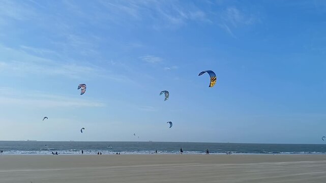 Some people practicing kitesurfing on Olho d'&Aacute;gua beach, in S&atilde;o Lu&iacute;s, Maranh&atilde;o, northeastern Brazil.