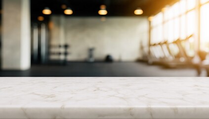 Marble table surface providing copy space, ideal for product display or text over a blurred gym interior with fitness equipment