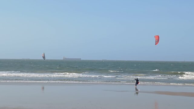 Some people practicing kitesurfing on Olho d'&Aacute;gua beach, in S&atilde;o Lu&iacute;s, Maranh&atilde;o, northeastern Brazil.