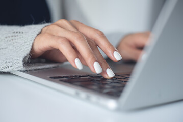 Closeup, woman, typing, on laptop computer, surfing the internet, online working at office