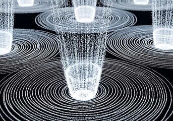 Illuminated digital particles flow downward creating concentric wave patterns on a dark surface