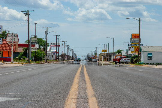 typical american street at the village of Hobbs with electric pylons at the street, USA