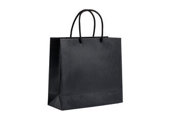 Single black textured paper shopping bag with rope handles on black background image