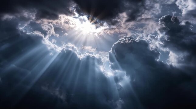Dramatic sun rays breaking through dark storm clouds in the sky