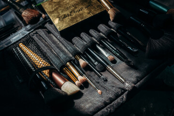 make up brushes on black cloth