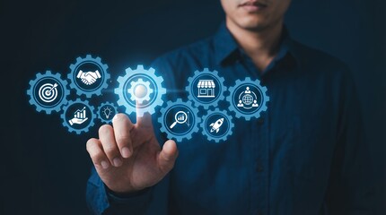 Man's finger touching glowing blue gear icons depicting business strategy growth partnership innovation research global connection and startup launch against dark background Management
