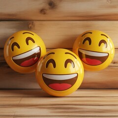 Three laughing emojis on a wooden background