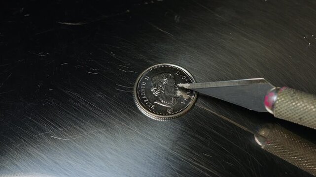 Fentanyl of two milligrams on the ten cents Canadian coin, lethal dose for people in most cases. Fentanyl very potent synthetic opioid drug approved for use as an analgesic, pain relief.