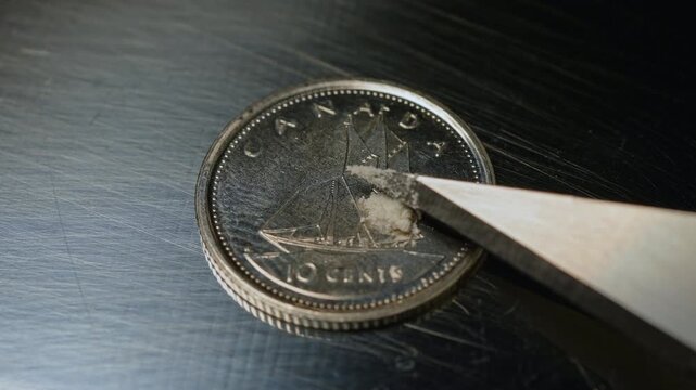 Fentanyl of two milligrams on the ten cents Canadian coin, lethal dose for people in most cases. Fentanyl very potent synthetic opioid drug approved for use as an analgesic, pain relief.