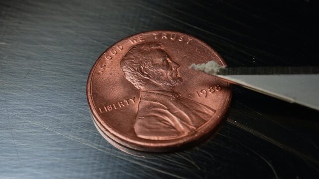 Fentanyl of two milligrams on the one cent coin or penny, lethal dose for people in most cases. Fentanyl very potent synthetic opioid drug approved by the FDA for use as an analgesic, pain relief.