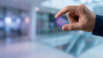 Hand holding microchip high tech level planning symbolizing digital innovation and futuristic data strategy in modern office environment