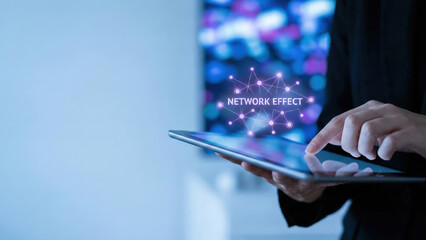 Network effect concept high level planning digital tablet touch screen futuristic business strategy virtual interface neon light modern office