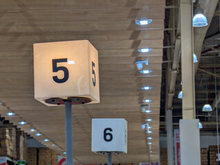 Warehouse aisle number markers for management and navigation