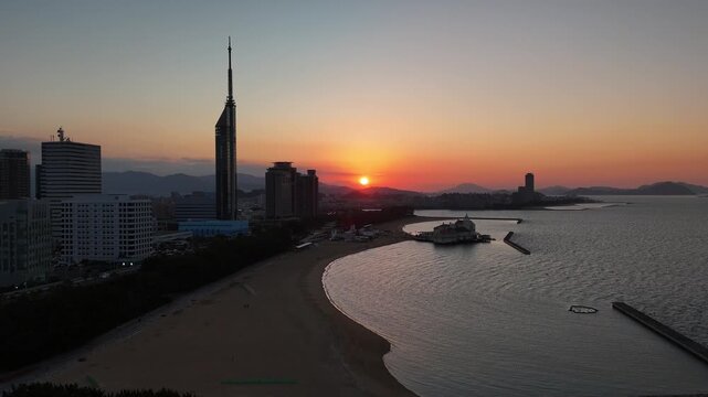 Fukuoka City, Japan at Sunset: 4K Aerial Drone Footage of Fukuoka Tower, Umisaki Park Beach, Hilton Fukuoka Sea Hawk, Mizuho PayPay Dome, City Skylines and Coastal Evening Views