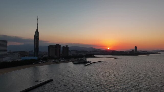 Fukuoka City, Japan at Sunset: 4K Aerial Drone Footage of Fukuoka Tower, Umisaki Park Beach, Hilton Fukuoka Sea Hawk, Mizuho PayPay Dome, City Skylines and Coastal Evening Views