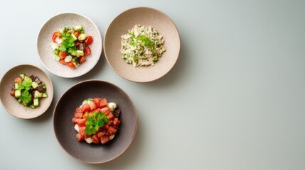 Colorful assortment of fresh salads and grains served in rustic bowls on a pale surface showcasing healthy vegetarian meal options and vibrant ingredients