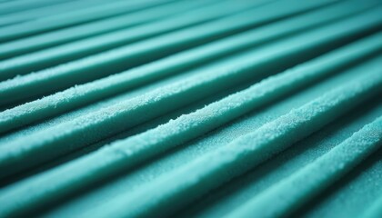 Layered turquoise acoustic foam panels with subtle lighting create a textured background. The parallel lines offer a clean, modern, and geometric design element.