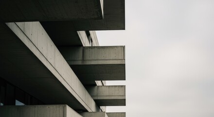 Modern concrete balconies against a cloudy sky