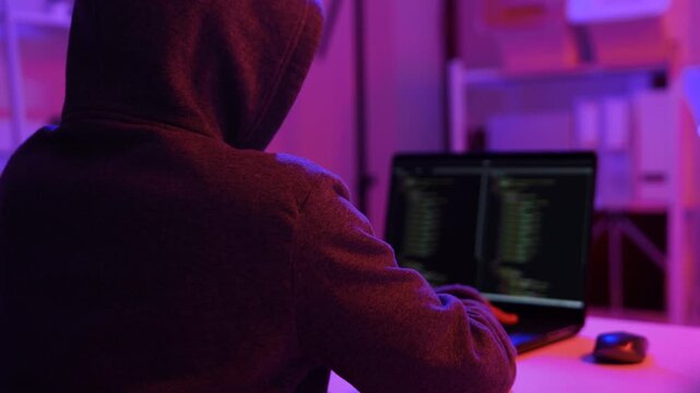 Hacker scammer coding trojan or computer virus to hacking security system break secret organization system. 