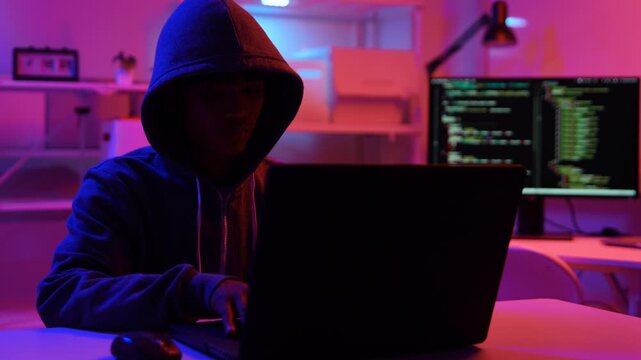 Hacker scammer coding trojan or computer virus to hacking security system break secret organization system. 