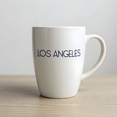 a white coffee mug with the word los angeles