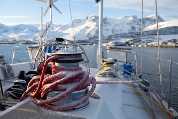 sailing in winter, closeup of winch with snow, sailboat yacht expedition in Antractica