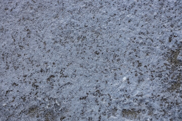 Obraz premium Full frame abstract texture background of shoveled snow on a cement sidewalk surface