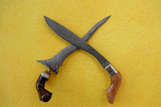 Indonesian Traditional Weapons (Badik) On Yellow Textured Backround